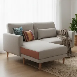 Compact two-seater sofa with reversible chaise, offering adaptable comfort and maximizing seating in a small, stylish living room.